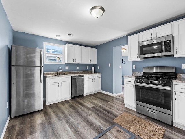 kitchen with white cabinetry, sink, and stainless steel appliances