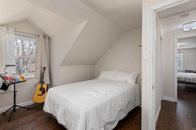 bedroom featuring vaulted ceiling and dark hardwood / wood-style floors