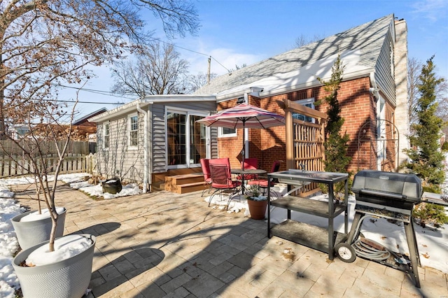 rear view of property featuring a patio area