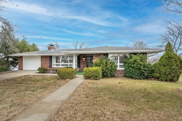 single story home featuring a garage and a front yard