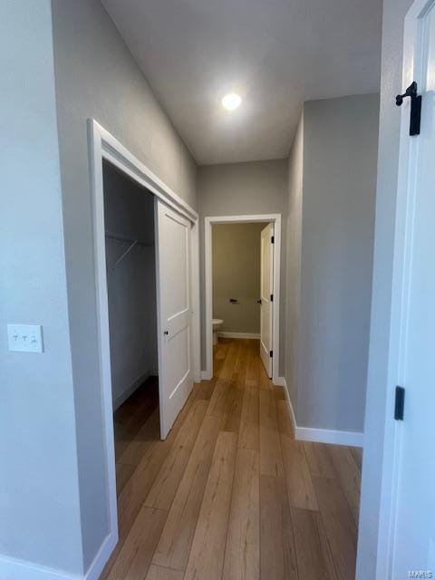 hall with light hardwood / wood-style flooring