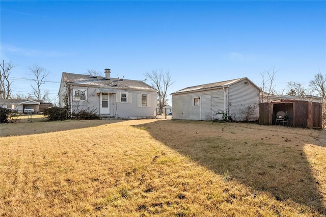 back of house with a yard