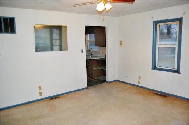 empty room with sink and ceiling fan