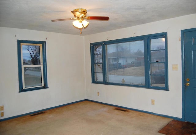 spare room featuring ceiling fan and a textured ceiling