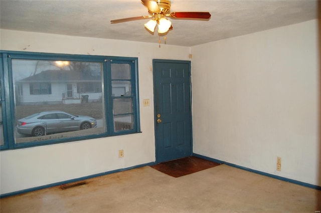 view of exterior entry with ceiling fan