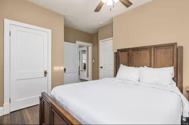 bedroom with ceiling fan and dark hardwood / wood-style flooring