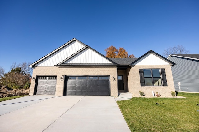 craftsman house featuring a front yard and a garage