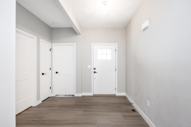 foyer entrance with hardwood / wood-style floors