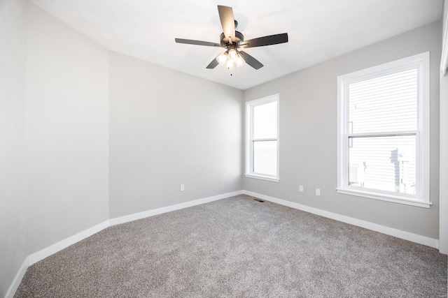 spare room with ceiling fan and carpet floors