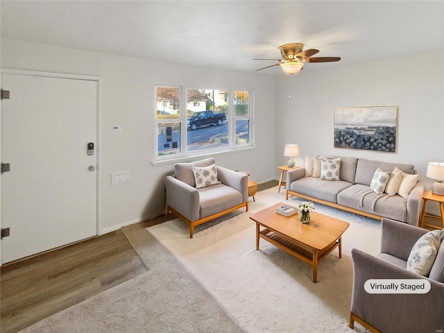 living room with ceiling fan and hardwood / wood-style floors