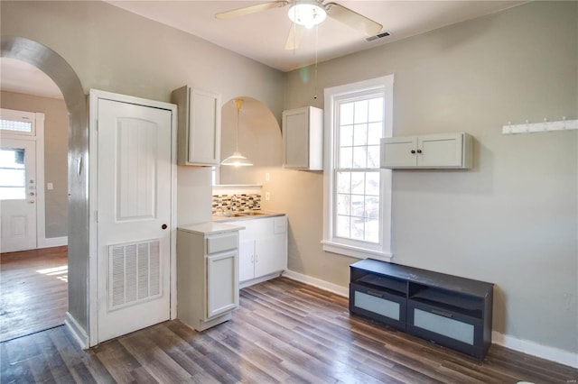 kitchen featuring white cabinetry, visible vents, and light countertops