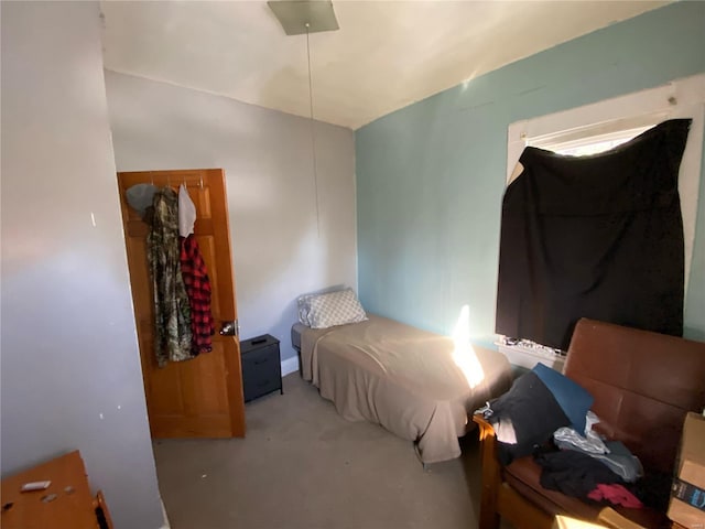 carpeted bedroom featuring lofted ceiling