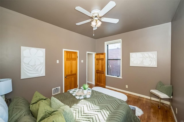 bedroom featuring ceiling fan and hardwood / wood-style flooring