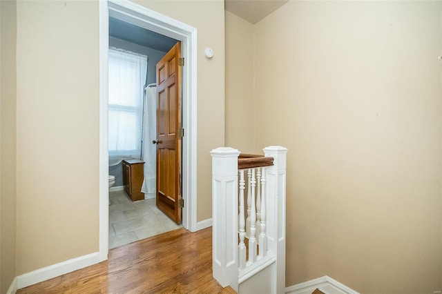 hall with light hardwood / wood-style flooring