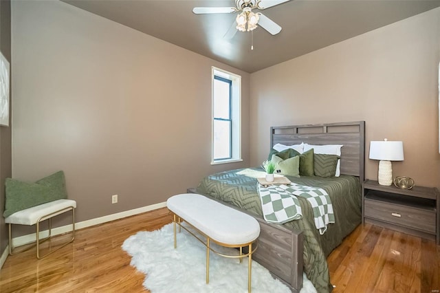 bedroom featuring light hardwood / wood-style floors and ceiling fan