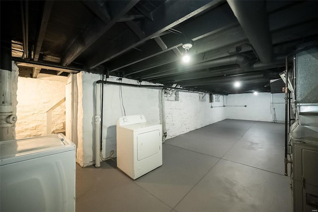 basement with washer and clothes dryer