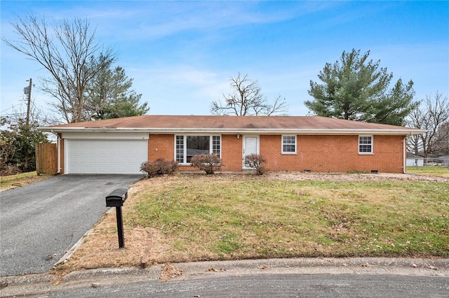 single story home featuring a garage and a front lawn