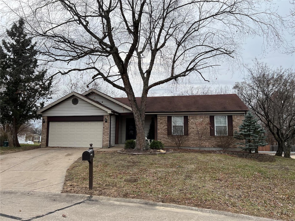 single story home with concrete driveway, brick siding, and an attached garage