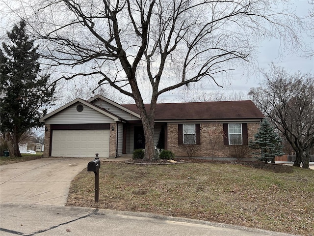 single story home with concrete driveway, brick siding, and an attached garage