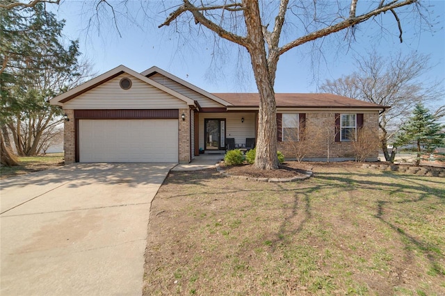 single story home featuring brick siding, an attached garage, and driveway