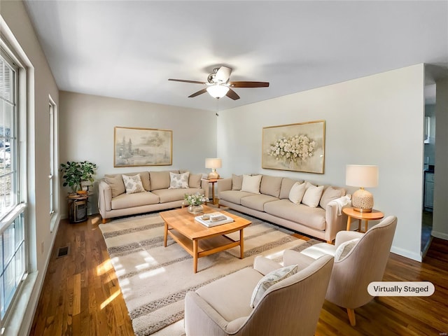 living room featuring hardwood / wood-style flooring, plenty of natural light, and ceiling fan