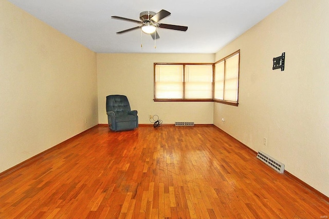 interior space featuring ceiling fan and hardwood / wood-style flooring