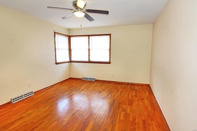 unfurnished room featuring ceiling fan and light wood-type flooring