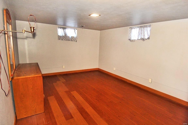 basement with wood-type flooring