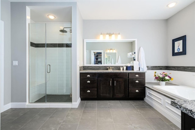 bathroom with vanity, tile patterned floors, and separate shower and tub