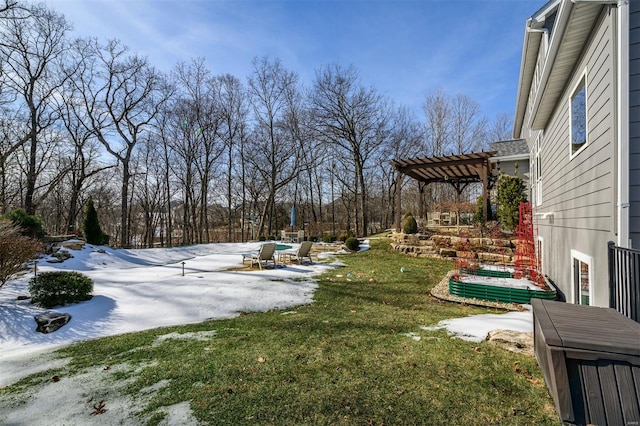 yard covered in snow with a pergola