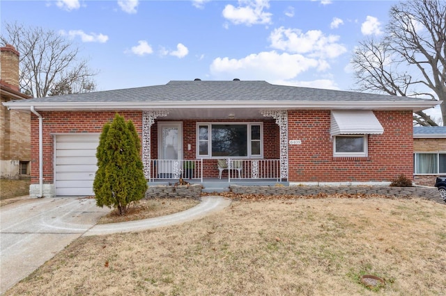 single story home featuring a front lawn, a porch, and a garage