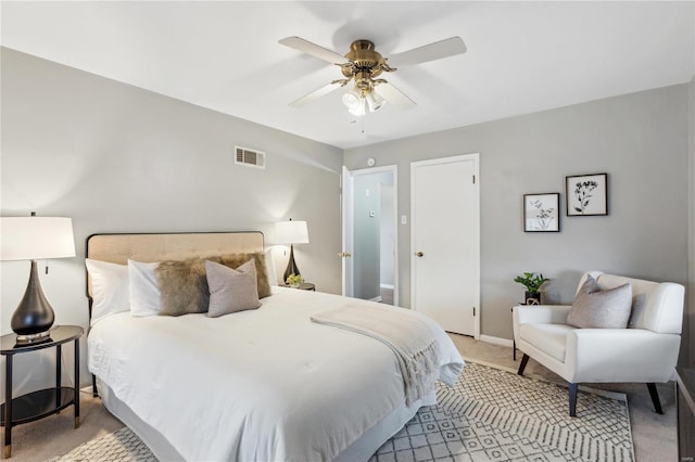 bedroom with ceiling fan and light carpet