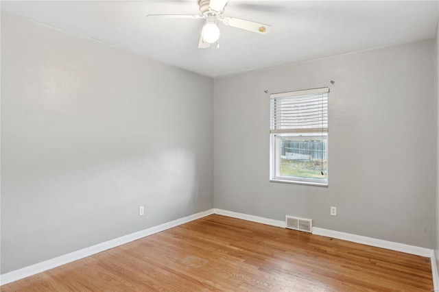 unfurnished room featuring light hardwood / wood-style flooring and ceiling fan