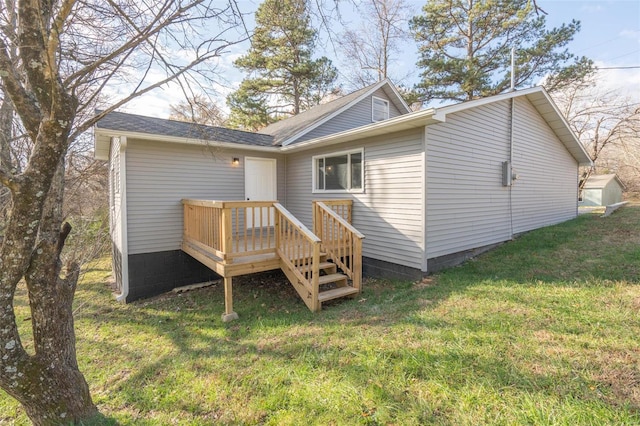 back of house with a yard and a deck