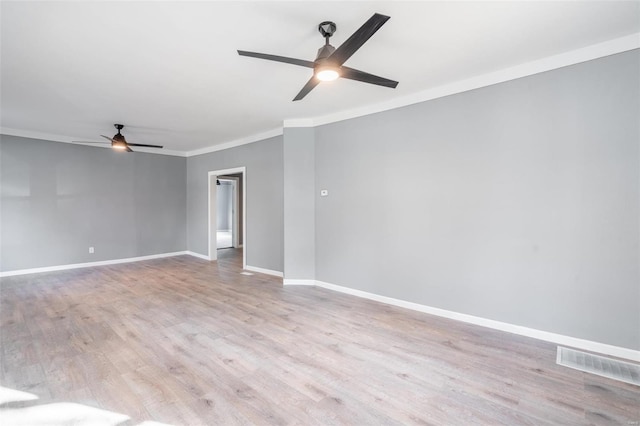 unfurnished room with crown molding and light hardwood / wood-style flooring