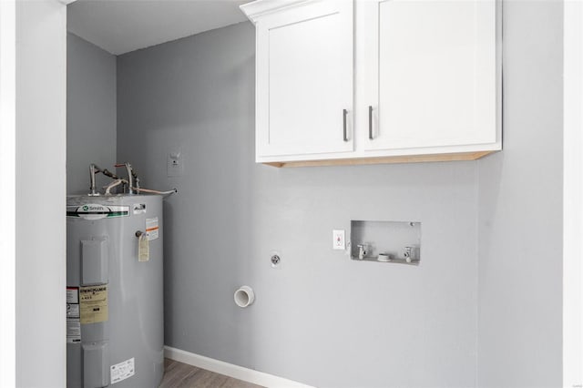 laundry area featuring hardwood / wood-style floors, electric dryer hookup, cabinets, hookup for a washing machine, and water heater