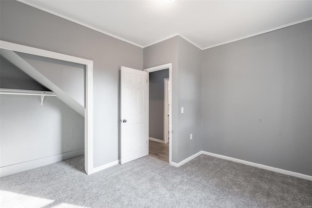 unfurnished bedroom with carpet floors and crown molding