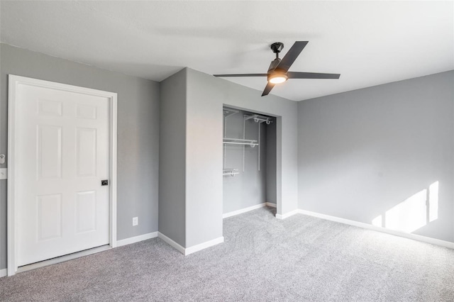 unfurnished bedroom with ceiling fan, a closet, and light carpet