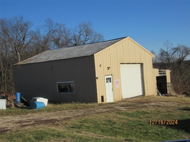 view of outbuilding featuring a garage