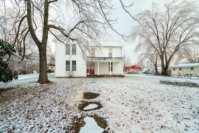 view of snow covered house