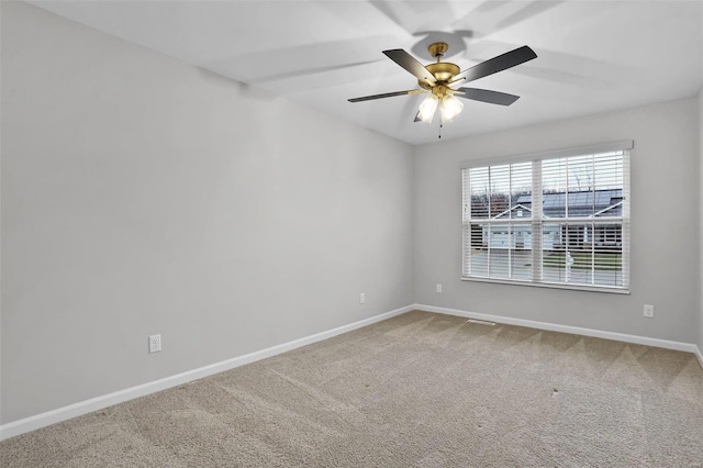 carpeted empty room with ceiling fan