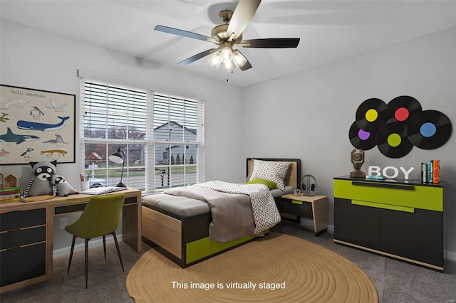 bedroom featuring ceiling fan and dark colored carpet