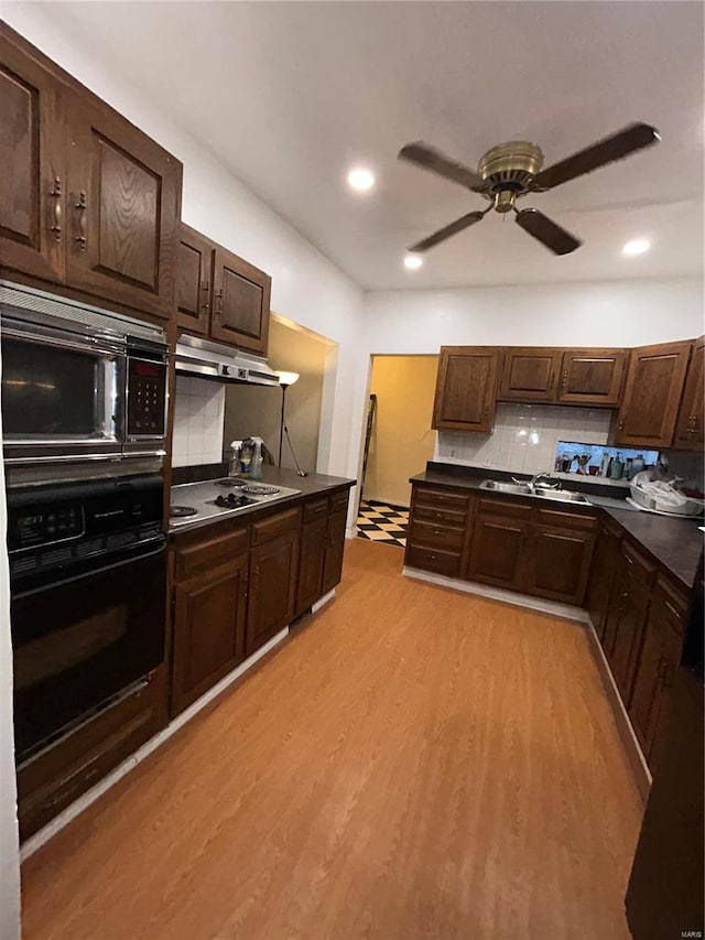 kitchen with tasteful backsplash, black appliances, ceiling fan, dark brown cabinetry, and light hardwood / wood-style floors