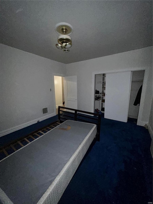 unfurnished bedroom featuring dark colored carpet