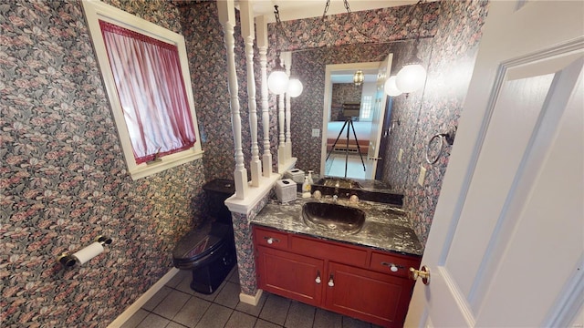 bathroom featuring toilet, vanity, and tile patterned floors