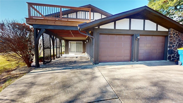 view of front of house with a garage and a balcony