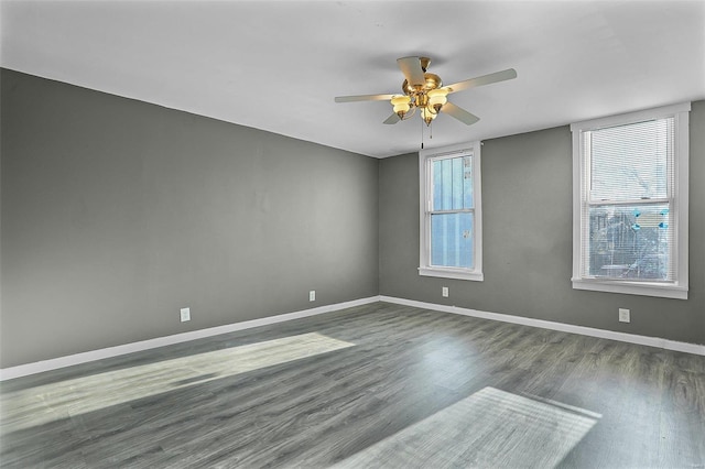 spare room with hardwood / wood-style flooring and ceiling fan