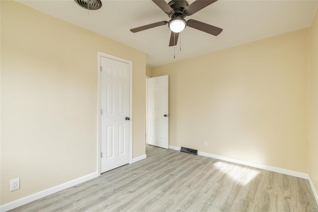 unfurnished room featuring ceiling fan and light hardwood / wood-style floors