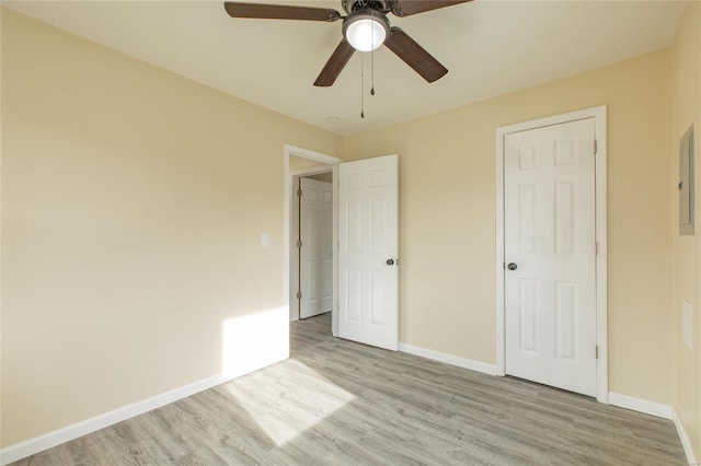 unfurnished bedroom with ceiling fan, a closet, and light hardwood / wood-style flooring