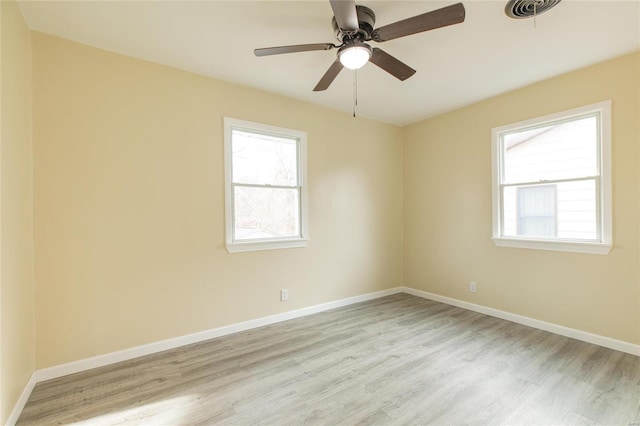 unfurnished room featuring light hardwood / wood-style floors and ceiling fan